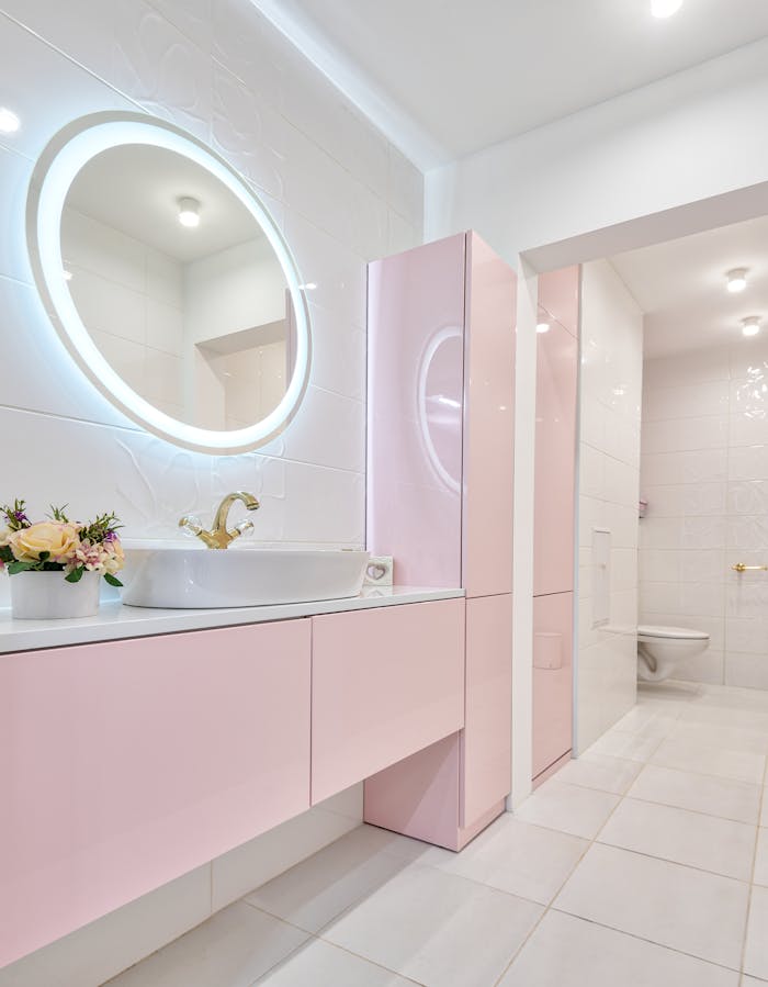 why-choose-us-01 Stylish modern bathroom featuring pink cabinetry and elegant decoration, perfect for home luxury inspiration.